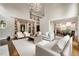 Bright, modern living room features soaring ceilings, large windows, and an open floor plan with views into the kitchen at 3925 Sheldon Ne Dr, Atlanta, GA 30342