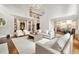 Bright, modern living room features soaring ceilings, large windows, and an open floor plan with views into the kitchen at 3925 Sheldon Ne Dr, Atlanta, GA 30342