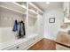 Mud room with built-in shelving and storage space for coats, shoes, and accessories by the exterior door at 3925 Sheldon Ne Dr, Atlanta, GA 30342