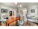 Bright office space with wood floors, trim detail, and multiple entry ways to other parts of the home at 3925 Sheldon Ne Dr, Atlanta, GA 30342