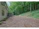Home features a large backyard with a screened-in porch and lush greenery at 82 Vanessa Se Dr, Smyrna, GA 30082