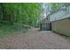 Home features a large backyard with a screened-in porch and lush greenery at 82 Vanessa Se Dr, Smyrna, GA 30082