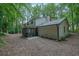 Home features a large backyard with a screened-in porch and lush greenery at 82 Vanessa Se Dr, Smyrna, GA 30082