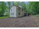 Home features a large backyard with a screened-in porch and lush greenery at 82 Vanessa Se Dr, Smyrna, GA 30082