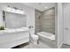 Bright bathroom features a modern vanity, sleek tile shower and tub, and a stylish design at 82 Vanessa Se Dr, Smyrna, GA 30082
