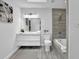 Bright bathroom features a modern vanity, sleek tile shower and tub, and a stylish design at 82 Vanessa Se Dr, Smyrna, GA 30082