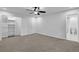 Spacious bedroom featuring walk-in closet, ensuite bath, and neutral carpet at 82 Vanessa Se Dr, Smyrna, GA 30082