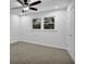 Neutral bedroom featuring ceiling fan, window, and neutral carpeting at 82 Vanessa Se Dr, Smyrna, GA 30082