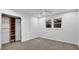 Bedroom featuring a ceiling fan, neutral carpet, closet and a window at 82 Vanessa Se Dr, Smyrna, GA 30082