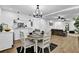 Bright dining area features wood floors, modern chandelier, and is open to the living room at 82 Vanessa Se Dr, Smyrna, GA 30082