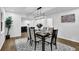 Formal dining room boasts modern chandelier and large windows that provide lots of natural light at 82 Vanessa Se Dr, Smyrna, GA 30082