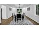 Formal dining room features stylish chandelier and large windows that provide lots of natural light at 82 Vanessa Se Dr, Smyrna, GA 30082