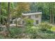 Picturesque home nestled among lush greenery, featuring a charming exterior and serene natural surroundings for a tranquil retreat at 82 Vanessa Se Dr, Smyrna, GA 30082