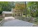 Charming home featuring a bridge leading to a well-manicured lawn and appealing facade at 82 Vanessa Se Dr, Smyrna, GA 30082