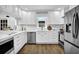 Bright kitchen with stainless steel appliances, white countertops, and ample cabinet space at 82 Vanessa Se Dr, Smyrna, GA 30082