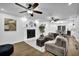 Bright living room featuring a fireplace, wood floors, and an open layout at 82 Vanessa Se Dr, Smyrna, GA 30082