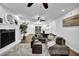 Spacious living room with fireplace, hardwood floors, and open layout to the dining area at 82 Vanessa Se Dr, Smyrna, GA 30082