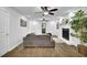 Cozy living room featuring hardwood floors, a fireplace, and plenty of natural light at 82 Vanessa Se Dr, Smyrna, GA 30082