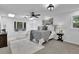 Bright main bedroom with ceiling fan, built-in bench seat, and accent lighting at 82 Vanessa Se Dr, Smyrna, GA 30082