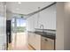 This modern kitchen features stainless steel appliances, granite countertops, and hardwood floors at 943 Peachtree Ne St # 716, Atlanta, GA 30309