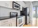 The kitchen features stainless steel appliances and white subway tile back splash at 943 Peachtree Ne St # 716, Atlanta, GA 30309