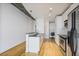 This bright kitchen features stainless steel appliances, granite countertops, and hardwood floors at 943 Peachtree Ne St # 716, Atlanta, GA 30309