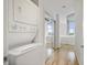 Convenient laundry area with a stacked washer and dryer, located near the bedroom at 943 Peachtree Ne St # 716, Atlanta, GA 30309
