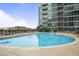 Inviting outdoor pool surrounded by lounge chairs and lush landscaping at 943 Peachtree Ne St # 716, Atlanta, GA 30309