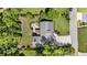 Aerial view of the property showcasing the house, roof, yard, patio, and neighborhood at 221 Brooke Dr., Alpharetta, GA 30009