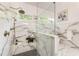 This bathroom features a large glass shower and marble-style tile at 221 Brooke Dr., Alpharetta, GA 30009