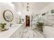 Luxurious bathroom with double vanity, soaking tub, a glass-enclosed shower, and modern finishes at 221 Brooke Dr., Alpharetta, GA 30009