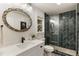 Elegant bathroom featuring stylish backsplash, modern fixtures, and a glass door shower at 221 Brooke Dr., Alpharetta, GA 30009