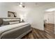 Comfortable bedroom featuring a cozy bed, grey walls, and hardwood floors at 221 Brooke Dr., Alpharetta, GA 30009