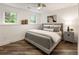 Cozy bedroom with two windows, grey walls, and hardwood floors at 221 Brooke Dr., Alpharetta, GA 30009