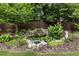 Landscaped garden with rock water feature, lush plantings, mulch and stone ground cover at 221 Brooke Dr., Alpharetta, GA 30009