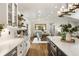Bright open concept kitchen leads to a dining area with coffered ceilings and lots of natural light at 221 Brooke Dr., Alpharetta, GA 30009