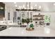 Gourmet kitchen featuring stainless steel appliances, custom white cabinets and a large island with white countertop at 221 Brooke Dr., Alpharetta, GA 30009