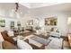 Spacious living room with hardwood floors, neutral decor, and large windows offering natural light at 221 Brooke Dr., Alpharetta, GA 30009