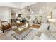 Open-concept living room featuring hardwood floors, a vaulted ceiling, and seamless flow to the dining area and kitchen at 221 Brooke Dr., Alpharetta, GA 30009