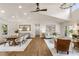 Open-concept living and dining area with hardwood floors, coffered ceilings, and plenty of natural light at 221 Brooke Dr., Alpharetta, GA 30009