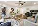 Inviting living room featuring a ceiling fan, home office, and ample natural light at 221 Brooke Dr., Alpharetta, GA 30009