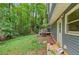 Spacious backyard with a deck offers privacy and access to a lush green space at 4585 Muirwood Cir, Powder Springs, GA 30127