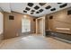 This basement features dark brown walls, sound-dampening tiles, and a long desk or workbench at 4585 Muirwood Cir, Powder Springs, GA 30127