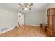 This bedroom features a ceiling fan, hardwood flooring, and a spacious closet for ample storage at 4585 Muirwood Cir, Powder Springs, GA 30127