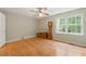 Cozy bedroom with a window offering natural light and backyard view at 4585 Muirwood Cir, Powder Springs, GA 30127