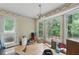 Sunlit dining area with large windows and access to the backyard at 4585 Muirwood Cir, Powder Springs, GA 30127