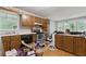 Well-lit kitchen with classic wood cabinets and functional layout at 4585 Muirwood Cir, Powder Springs, GA 30127