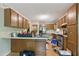 Functional kitchen with wood cabinets and stainless steel appliances at 4585 Muirwood Cir, Powder Springs, GA 30127