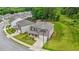 Aerial view of a well-maintained home featuring a front yard, driveway, and manicured landscaping at 603 River Gardens Se Dr, Atlanta, GA 30354