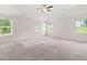 Spacious carpeted bedroom with ceiling fan and ample natural light at 603 River Gardens Se Dr, Atlanta, GA 30354
